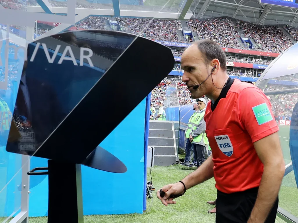 Referee checks with VAR following a goal