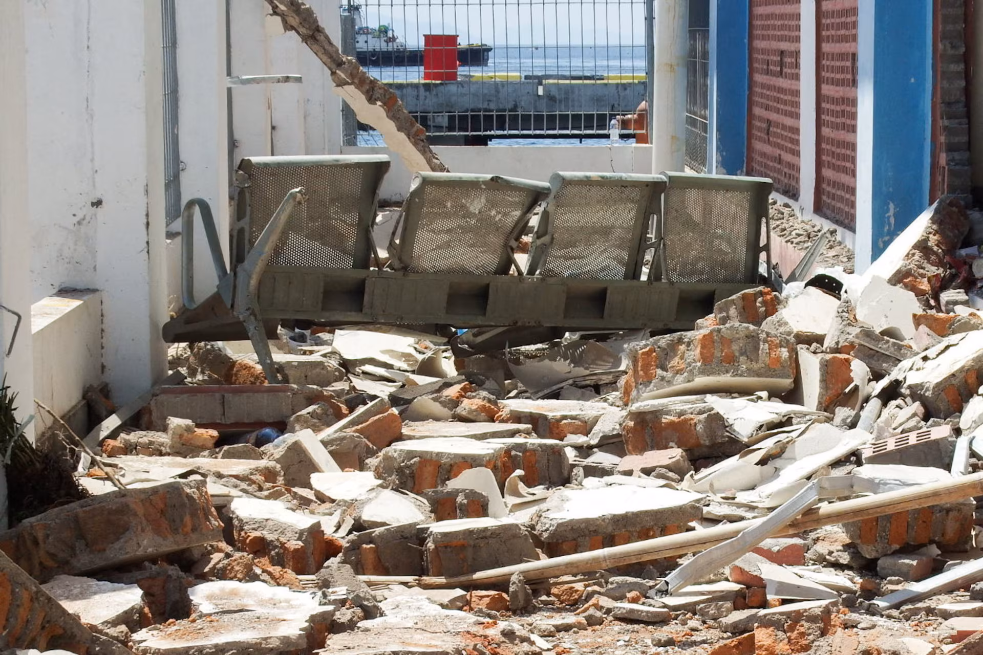 A bench sits among rubble at a heavily-damaged building at L. Say port following an earthquake in Maumere, Sikka, East Nusa Tenggara province, Indonesia, August 15, 2026. REUTERS/Stringer