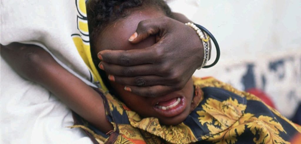 Hudan Mohammed Ali, 6, screams in pain while undergoing circumcision in Hargeisa, Somalia, June 17, 1996. Her sister Farhyia Mohammed Ali, 18, holds her so she cannot move. (AP Photo/Jean-Marc Bouju)
