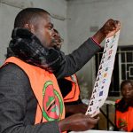 Election officials display a ballot paper while sorting and counting votes after polls close at a polling station during Zambia's general elections, including the presidential election, in Lusaka, Zambia. REUTERS/Moses Mwape
