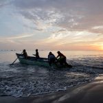 Fishermen work along the shore as local fishermen are increasingly being pursued by Ecuadorean gangs to move drugs and for their skills navigating the Pacific waters along Ecuador's coast, which has become a hub for the international smuggling of narcotics over the last half-decade, in Manta, Ecuador, June 4, 2026. REUTERS/Karen Toro
