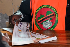 An election official holds a ballot at a polling station during Zambia's general elections, including a presidential election, in Lusaka, Zambia. REUTERS/Moses Mwape