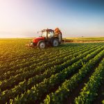 A tractor working in the fields