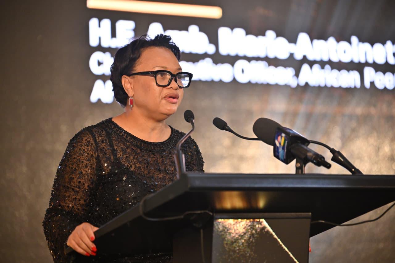H.E. Ambassador Marie-Antoinette Rose-Quatre, Chief Executive Officer of the African Peer Review Mechanism (APRM) Continental Secretariat, speaking at a podium.