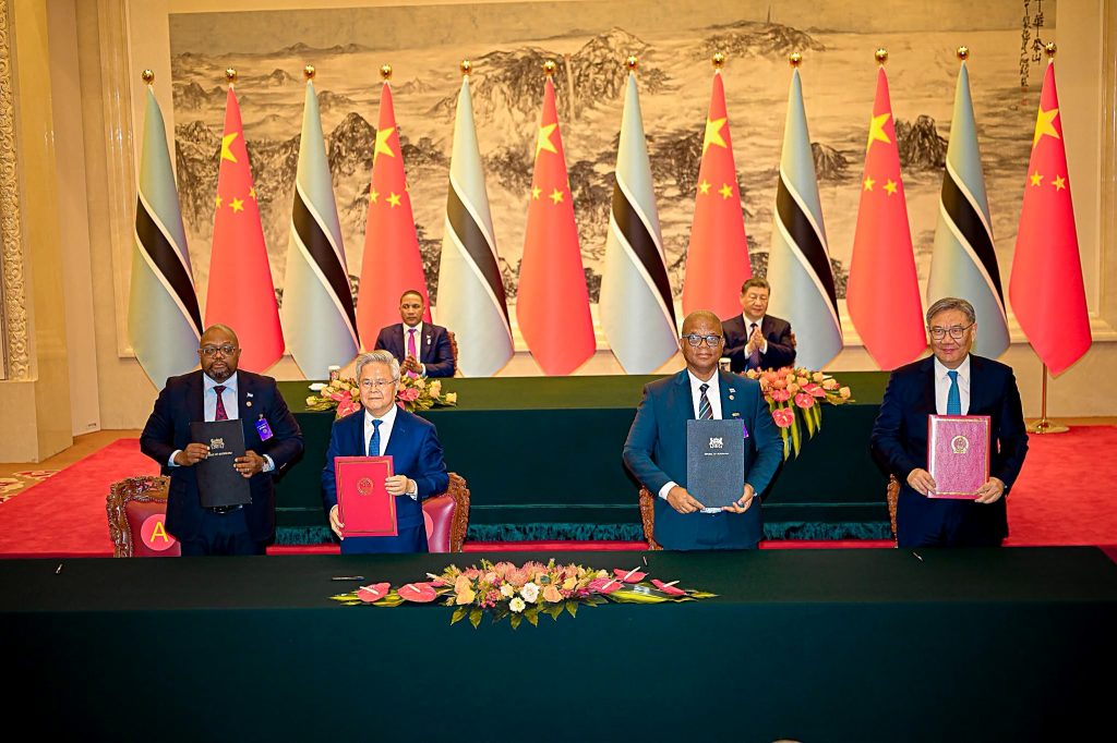 Botswana and Chinese officials display signed cooperation agreements as President Duma Boko and President Xi Jinping applaud in Beijing.