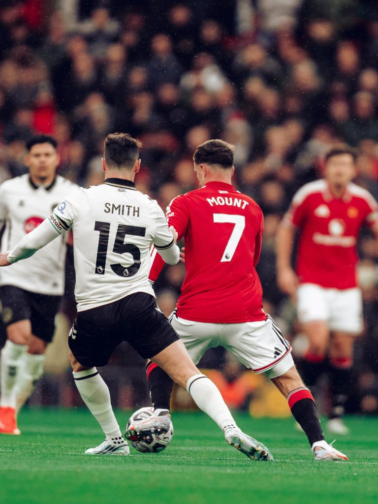 Bournemouth captain Adam Smith challenges Manchester United’s Mason Mount at Old Trafford on Sunday. Bournemouth won 3-0, leaving United 16th with seven points from eight matches.