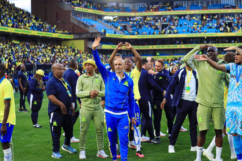 Cardoso celebrates with Sundowns players and staff in front of the club's supporters. The defending champions need a win at Loftus Versfeld on Friday to reach the CAF Champions League group stage.