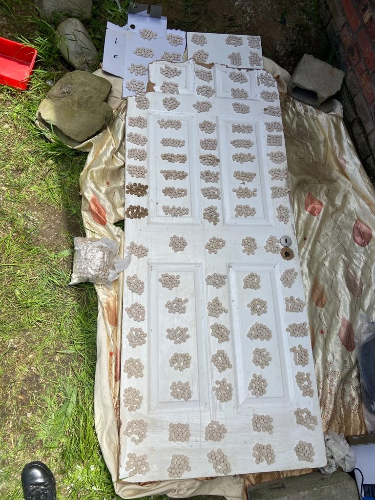Tablets suspected to be mandrax laid out and counted on a door after police raided a property in Rowallan Park, Gqeberha, on Saturday. A 38-year-old man was arrested.
