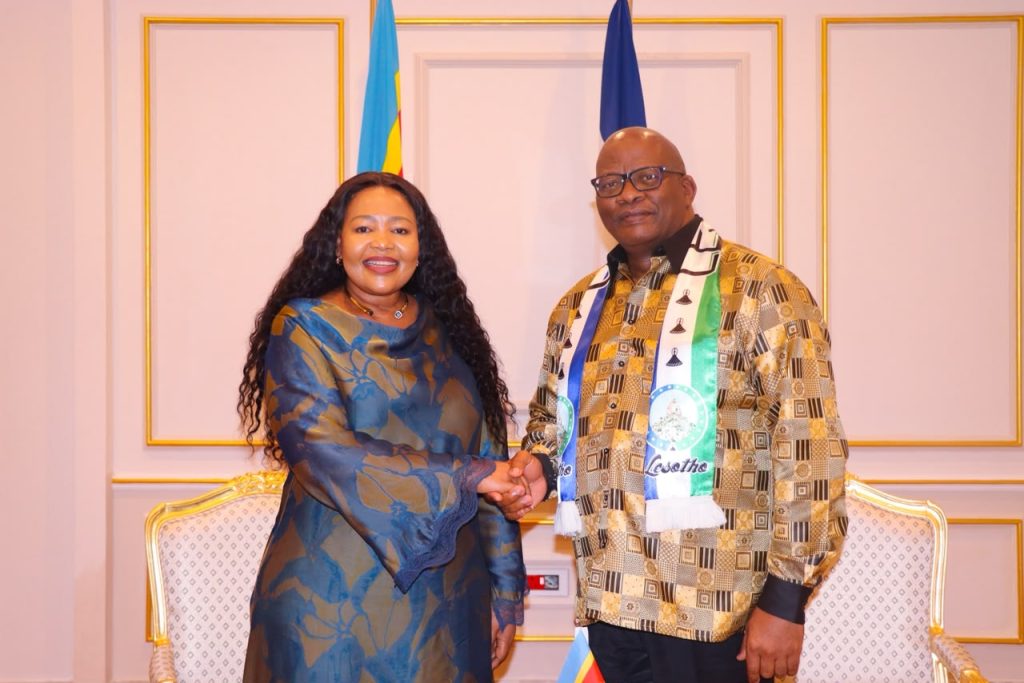 Shakantu and Tau shake hands after talks on reviving education cooperation and expanding trade between the two kingdoms.