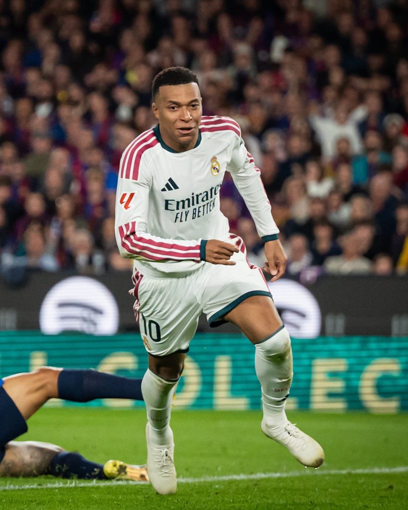 Mbappé wheels away after scoring for Real Madrid at Barcelona. His two goals cut Barcelona’s lead at the top of La Liga to three points.